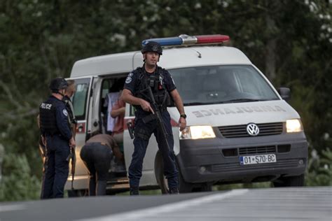 Kosovar police surround a village after Serb gunmen storm a monastery in violence that has killed 4